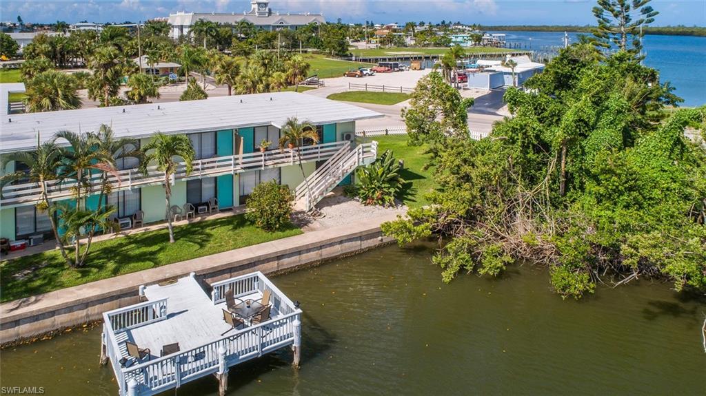 an aerial view of a house with a lake view
