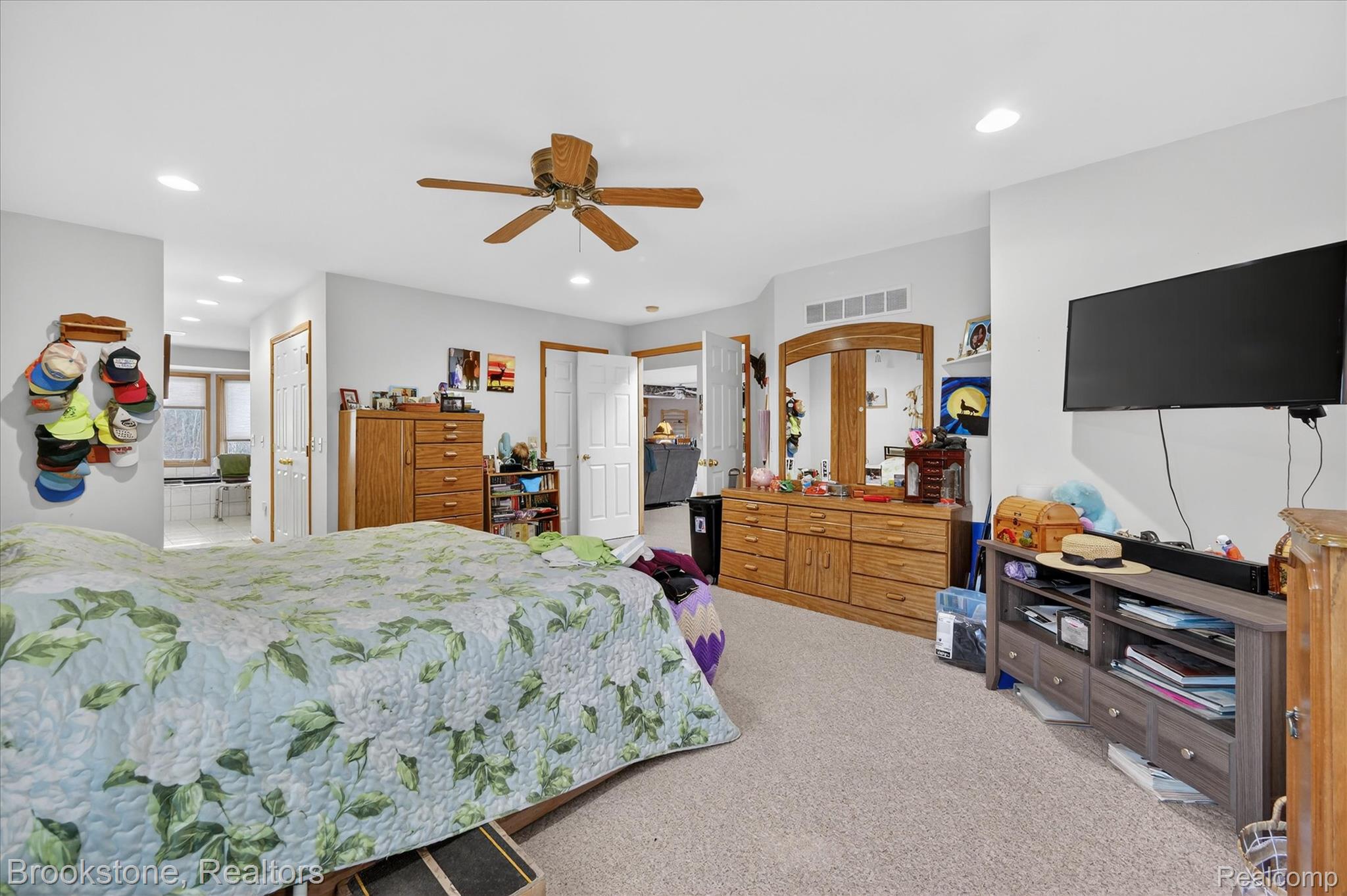 5163 Country Squire Road Dryden, MI 48428 - Photo 24 of 64 Bedroom with carpet, a ceiling fan, recessed lighting, and a closet