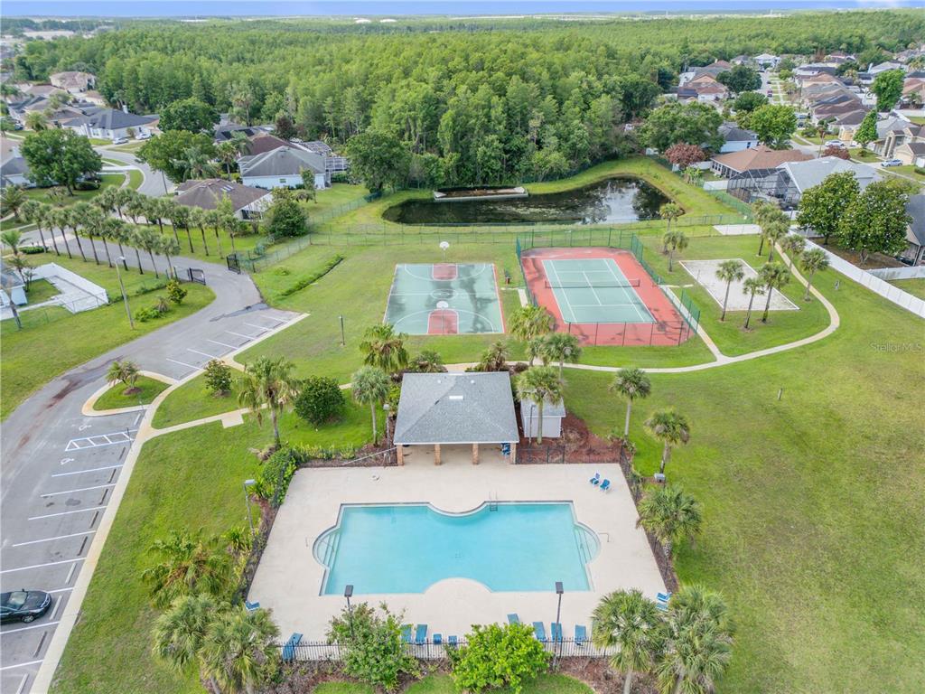 12232 Bronson Way Orlando, FL 32824 - Photo 29 of 32 an aerial view of a pool with a yard