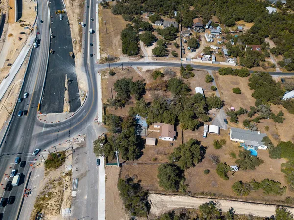 an aerial view of a residential houses with outdoor space