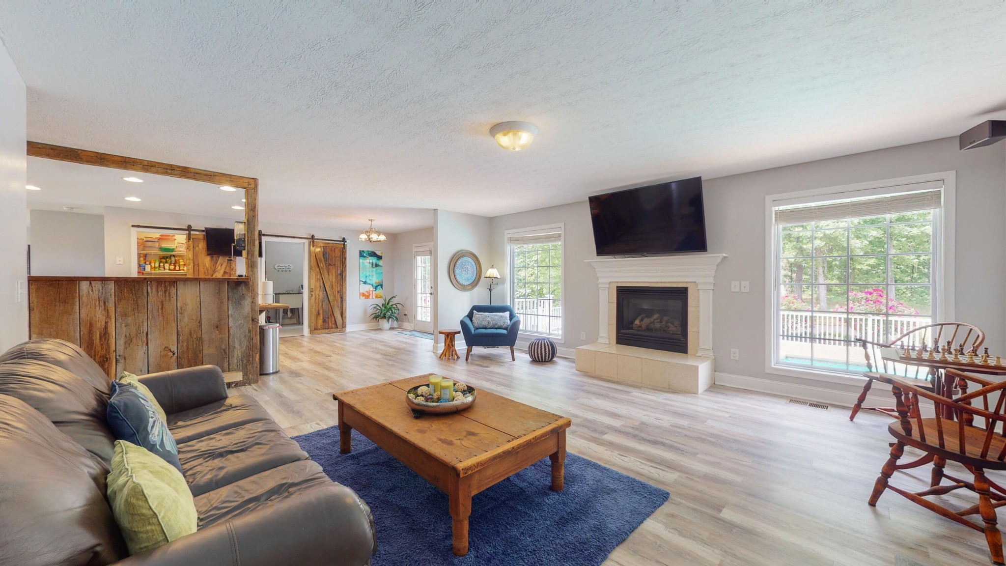 750 Stallcup Road Philadelphia, TN 37846 - Photo 6 of 32 a living room with furniture a flat screen tv and a fireplace