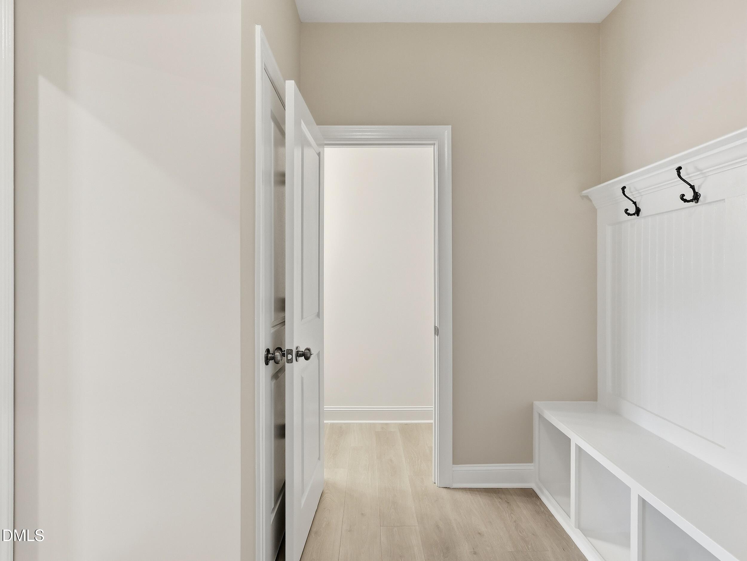 2709 Womble Ridge Drive New Hill, NC 27562 - Photo 26 of 60 a view of a hallway with wooden floor