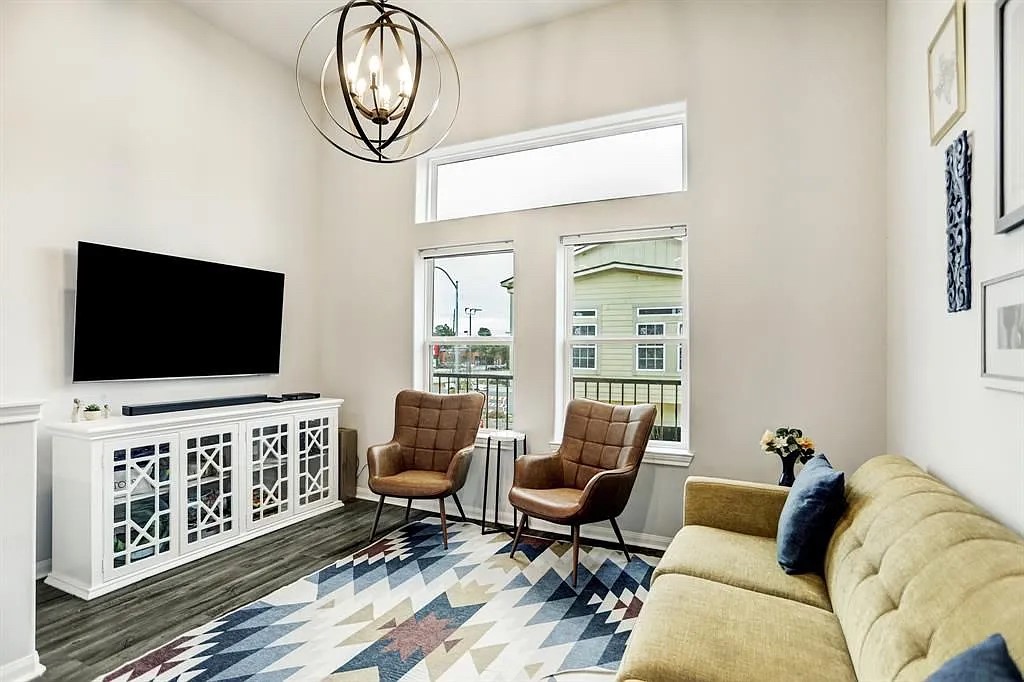 4906 Paradigm Ln Spring Spring, TX 77379 - Photo 3 of 17 a living room with furniture and a flat screen tv