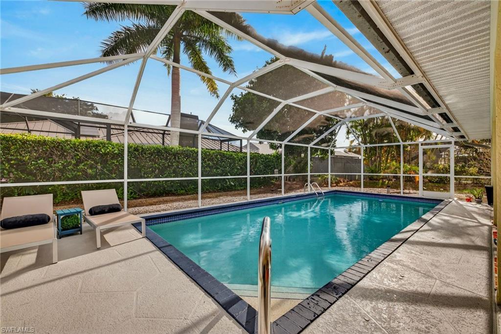 390 St Andrews Boulevard Naples, FL 34113 - Photo 25 of 42 View of swimming pool with screened in lanai