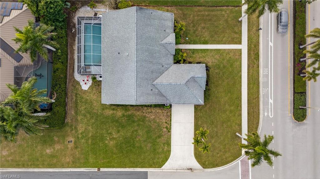 390 St Andrews Boulevard Naples, FL 34113 - Photo 40 of 42 Aerial view of property and surrounding area with a pool area