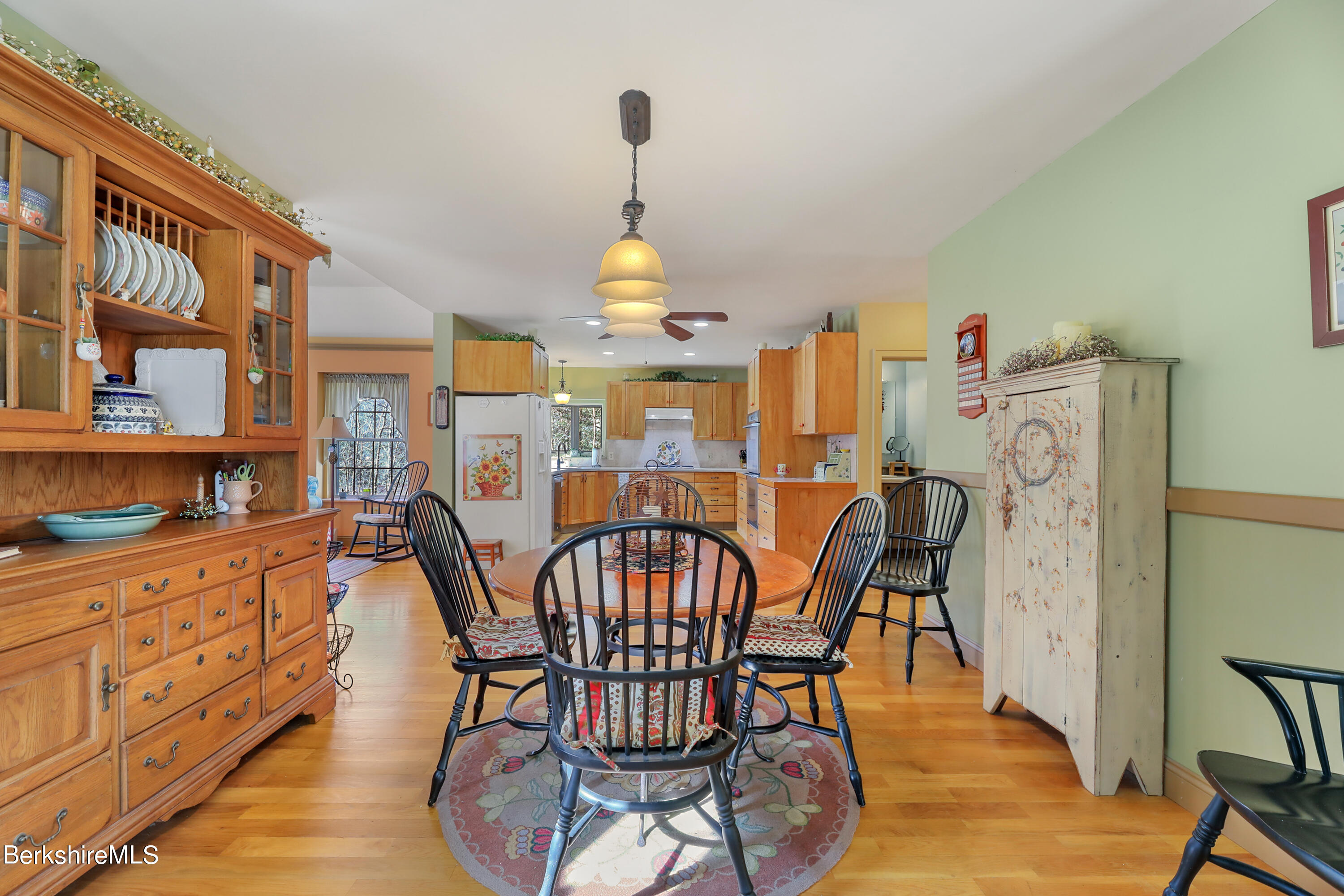 20 Ray Hubbard Road Otis, MA 01029 - Photo 11 of 59 a dining room with furniture a chandelier and wooden floor