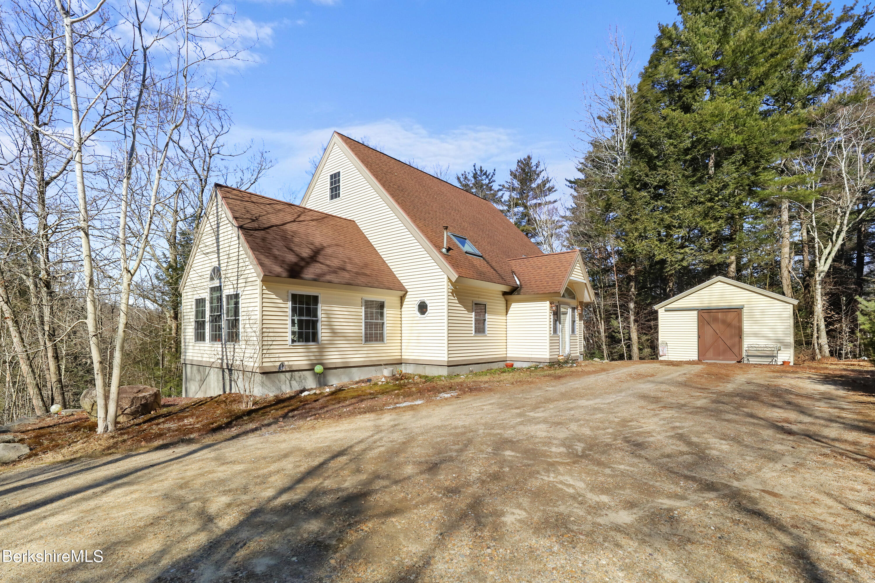 20 Ray Hubbard Road Otis, MA 01029 - Photo 2 of 59 a front view of a house with a yard