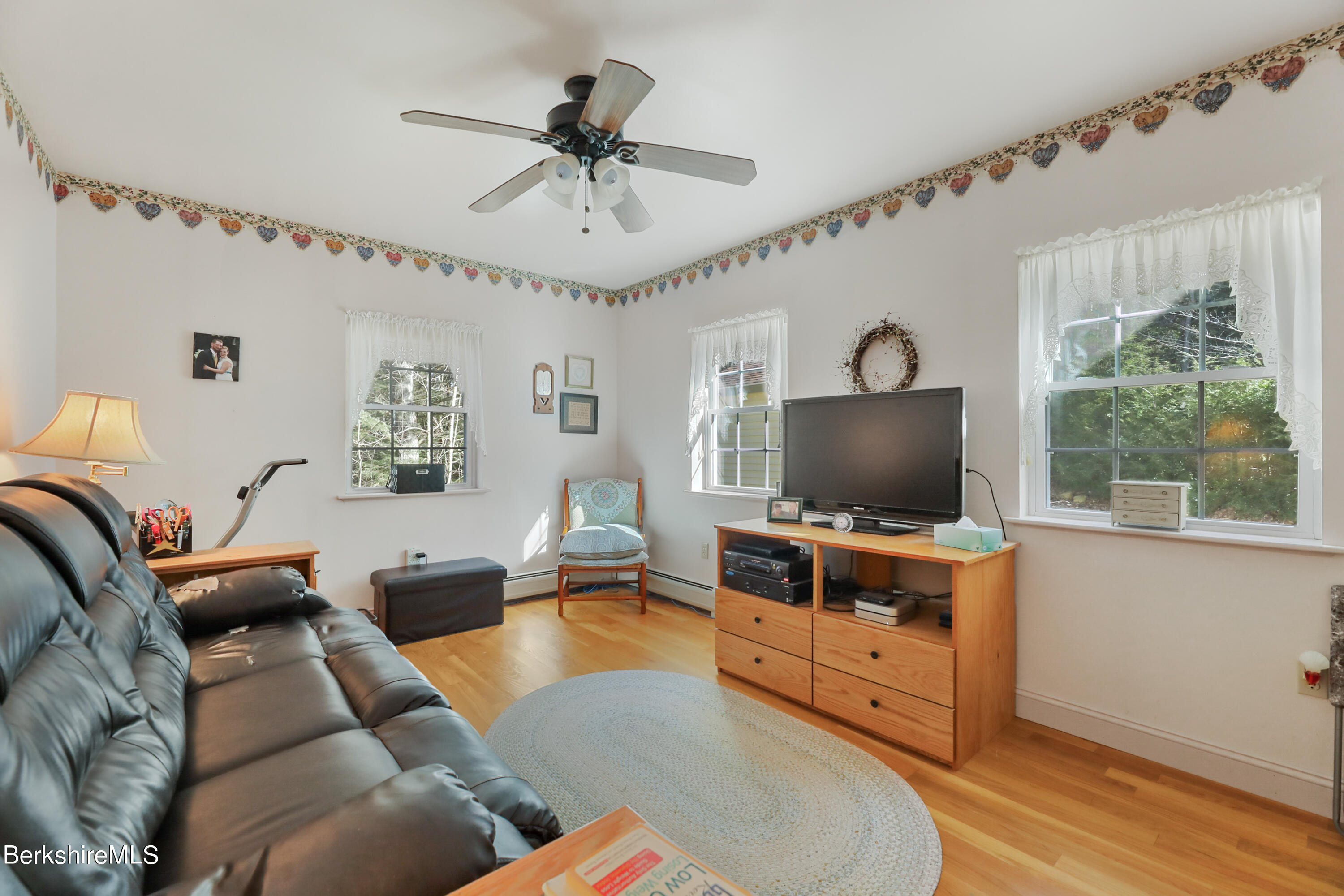 20 Ray Hubbard Road Otis, MA 01029 - Photo 27 of 59 a living room with furniture and a flat screen tv