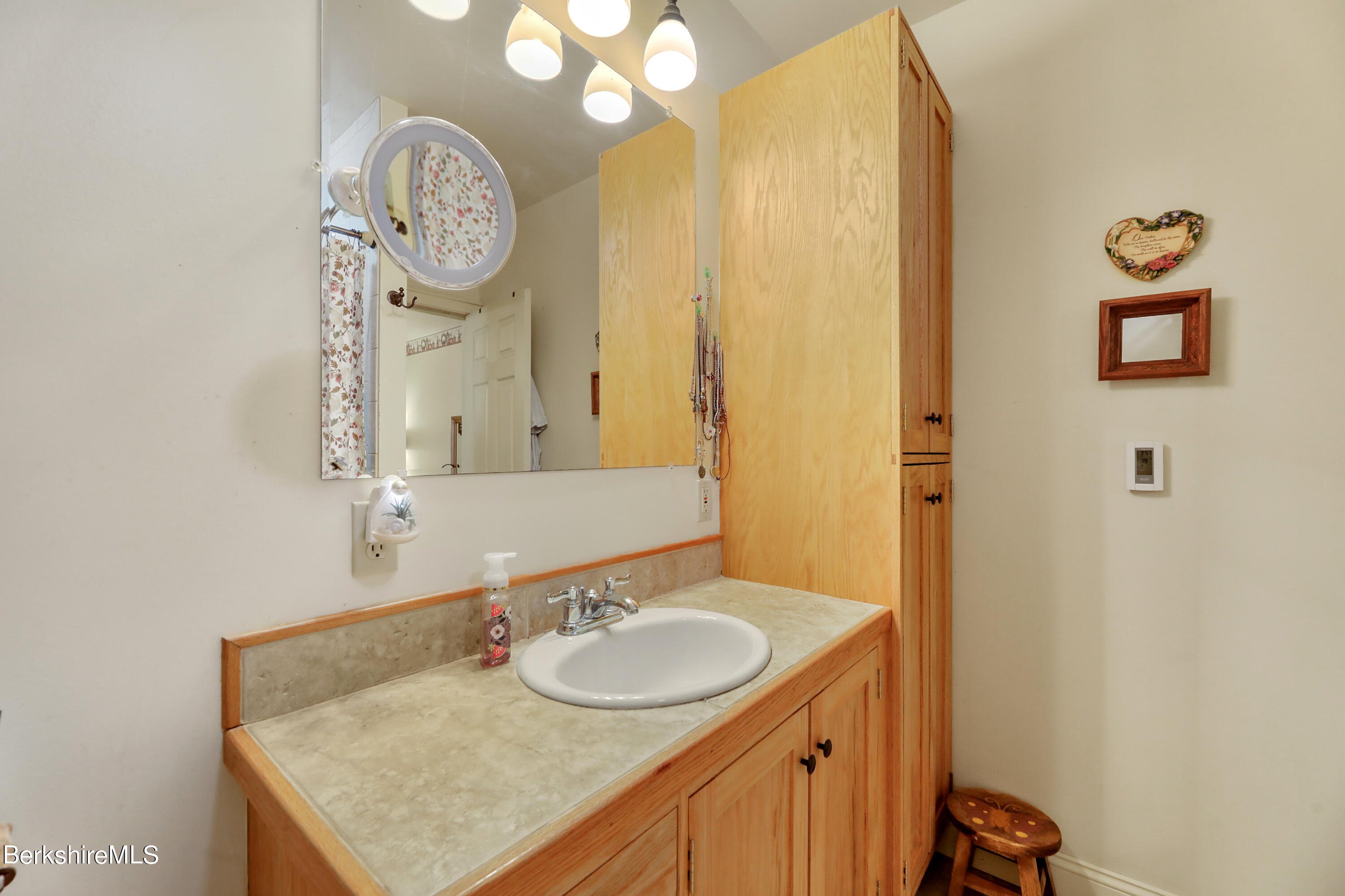 20 Ray Hubbard Road Otis, MA 01029 - Photo 32 of 59 a bathroom with a sink vanity and a mirror