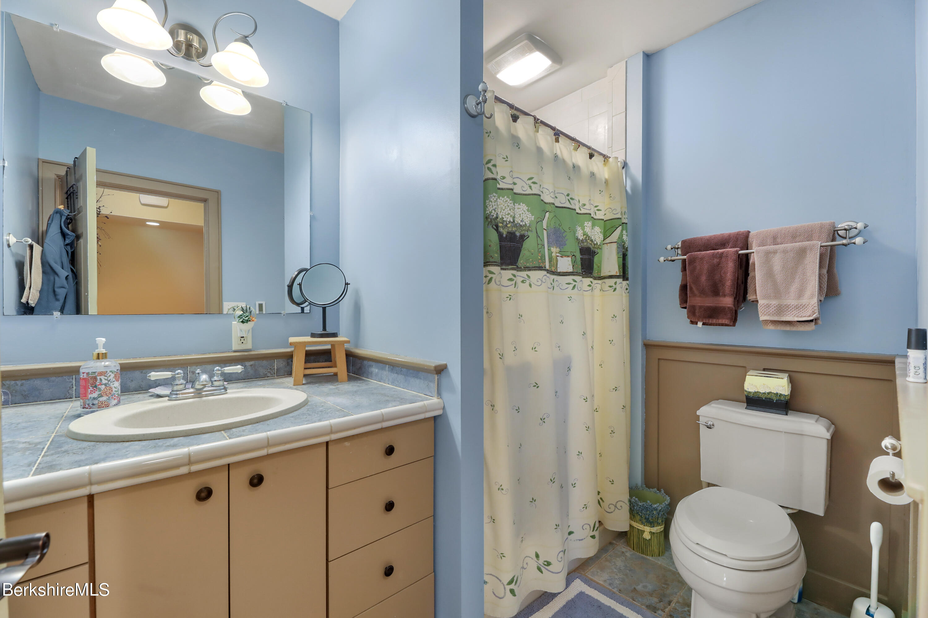 20 Ray Hubbard Road Otis, MA 01029 - Photo 33 of 59 a bathroom with a granite countertop toilet sink and mirror