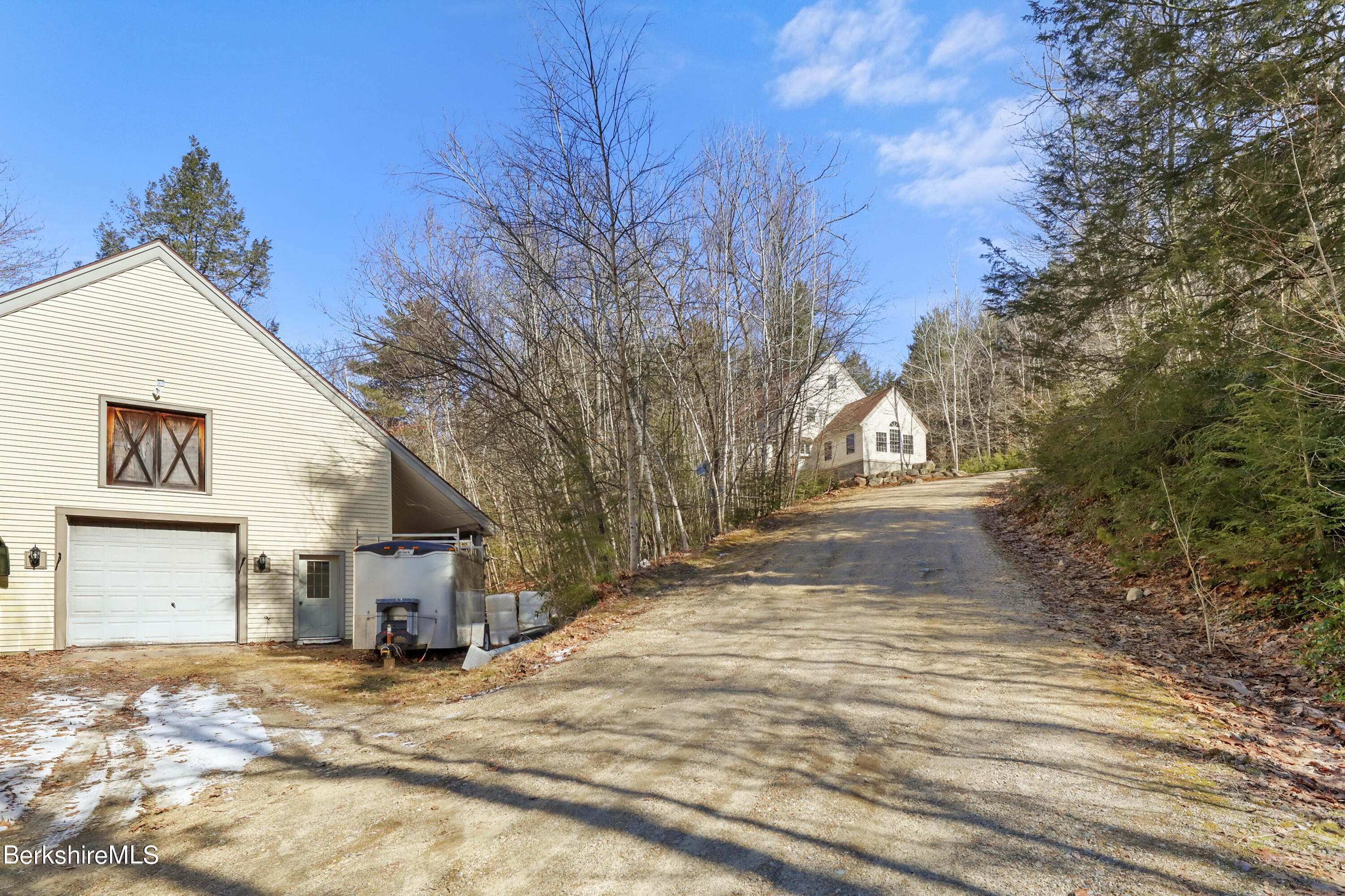 20 Ray Hubbard Road Otis, MA 01029 - Photo 5 of 59 a view of a house with snow on the road