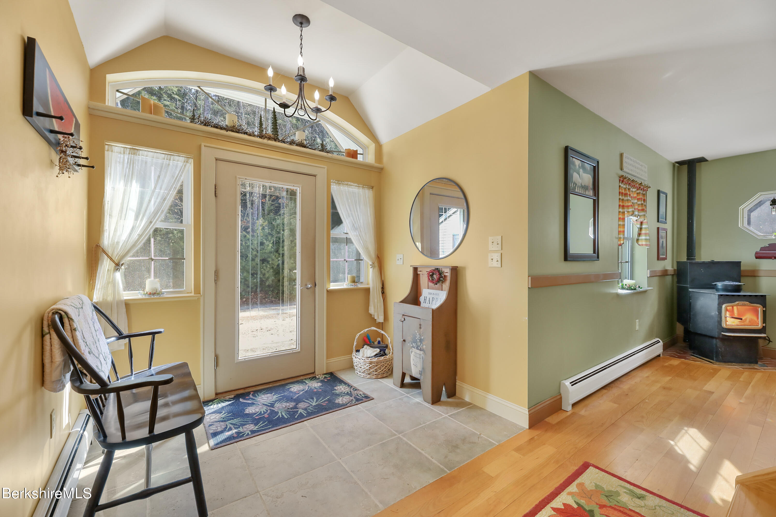 20 Ray Hubbard Road Otis, MA 01029 - Photo 7 of 59 a view of a livingroom with furniture mirror and a chandelier