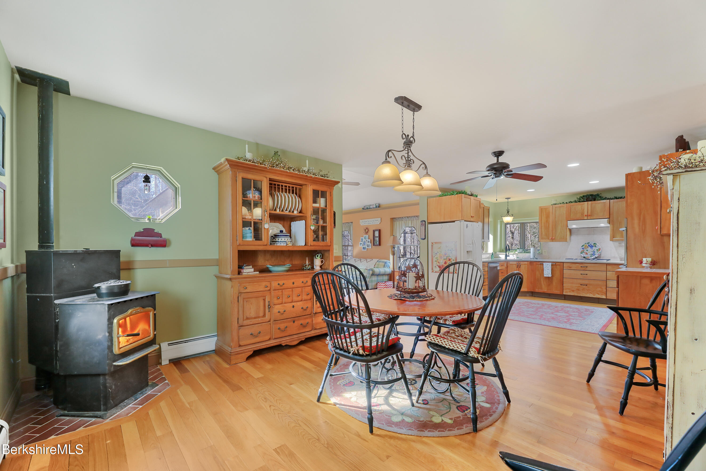 20 Ray Hubbard Road Otis, MA 01029 - Photo 10 of 59 a view of a dining room with furniture and chandelier
