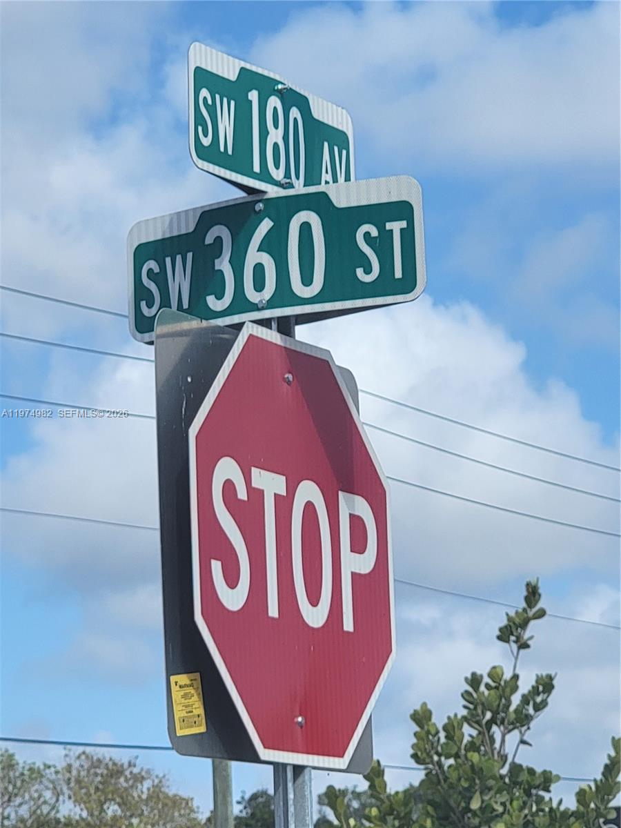 18150 Southwest 368th Street Homestead, FL 33034 - Photo 12 of 21 a close up of a street sign