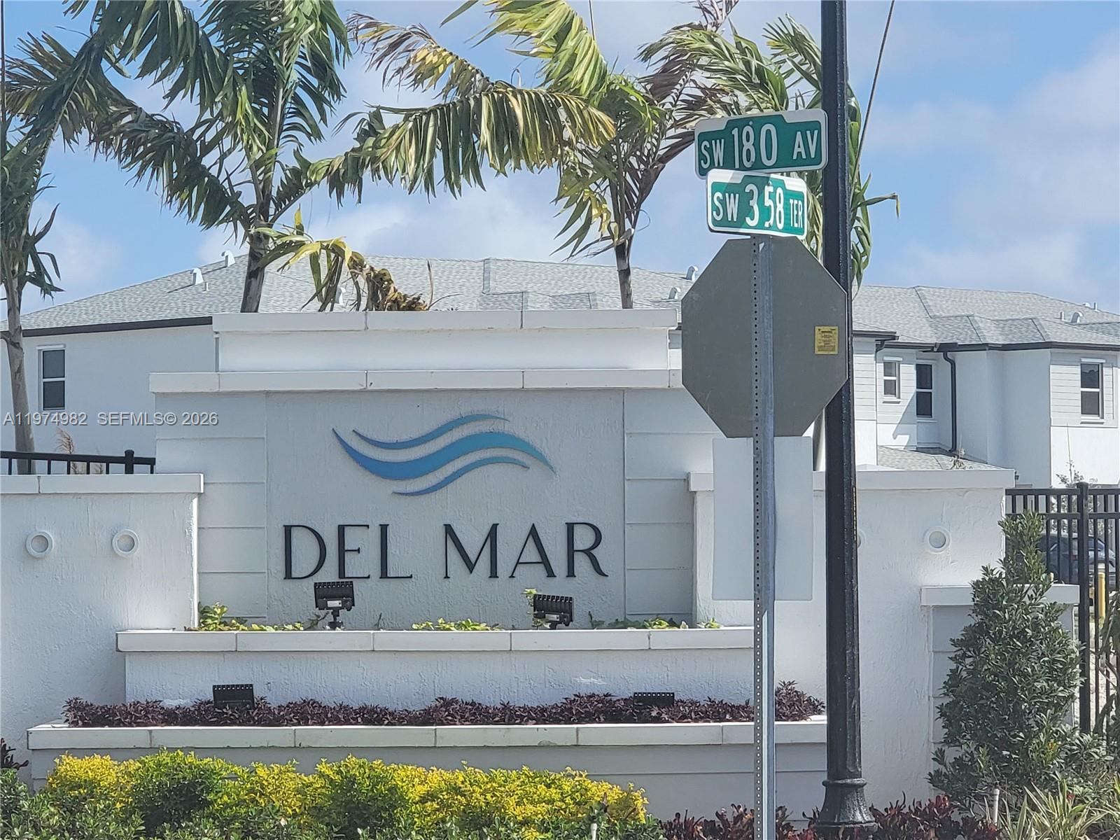 18150 Southwest 368th Street Homestead, FL 33034 - Photo 13 of 21 a vase of flowers sitting on a table in front of a house