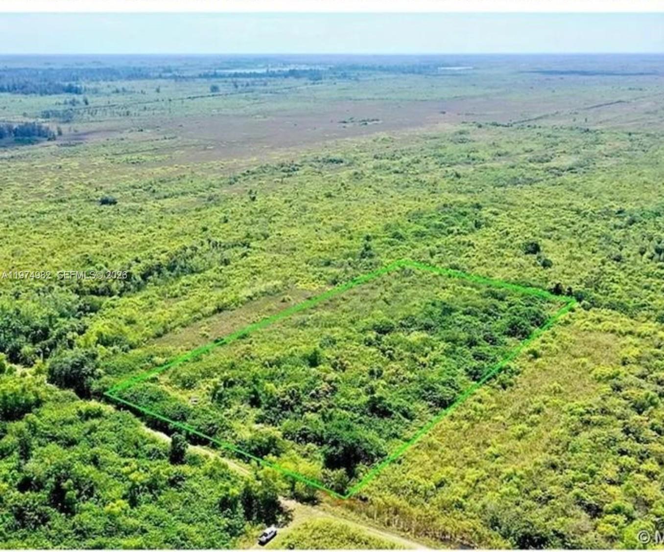 18150 Southwest 368th Street Homestead, FL 33034 - Photo 7 of 21 a view of a field with an outdoor space