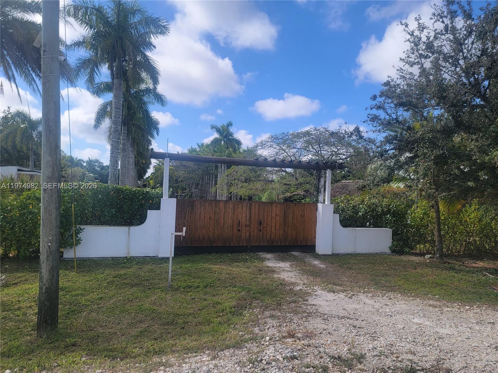 18150 Southwest 368th Street Homestead, FL 33034 - Photo 9 of 21 a backyard of a house with lots of green space