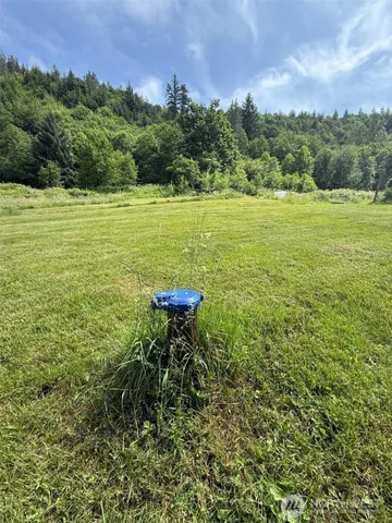 a view of a lake with a yard