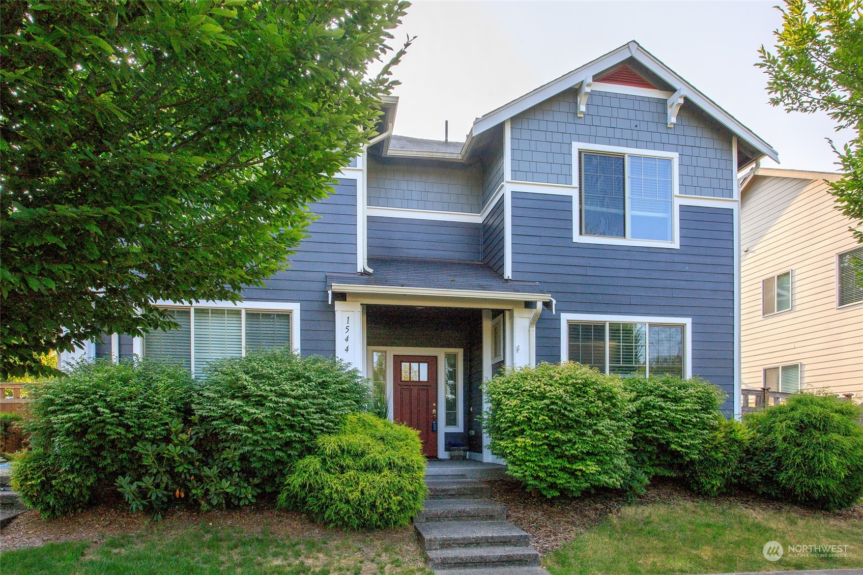 1544 Craig Road Southeast Olympia, WA 98501 - Photo 1 of 31 a front view of a house with garden