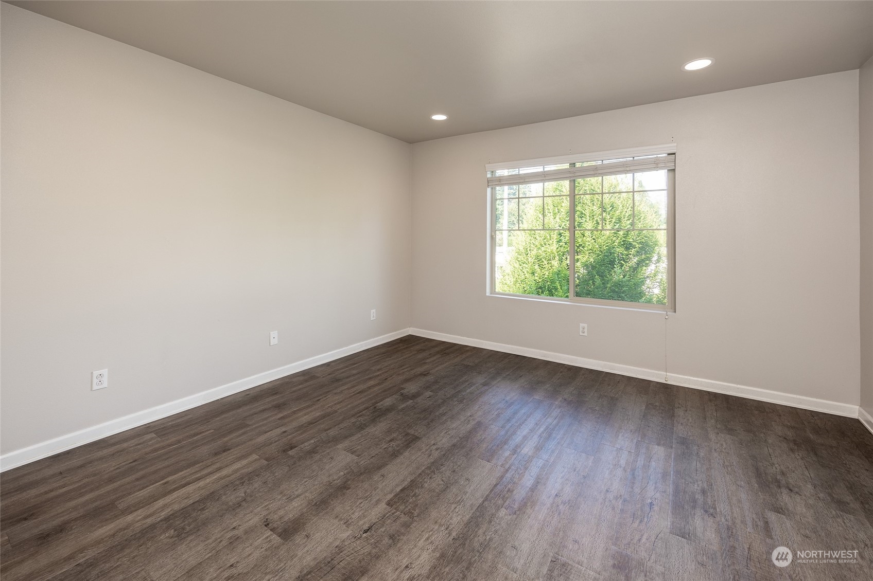 1544 Craig Road Southeast Olympia, WA 98501 - Photo 13 of 31 an empty room with wooden floor and windows