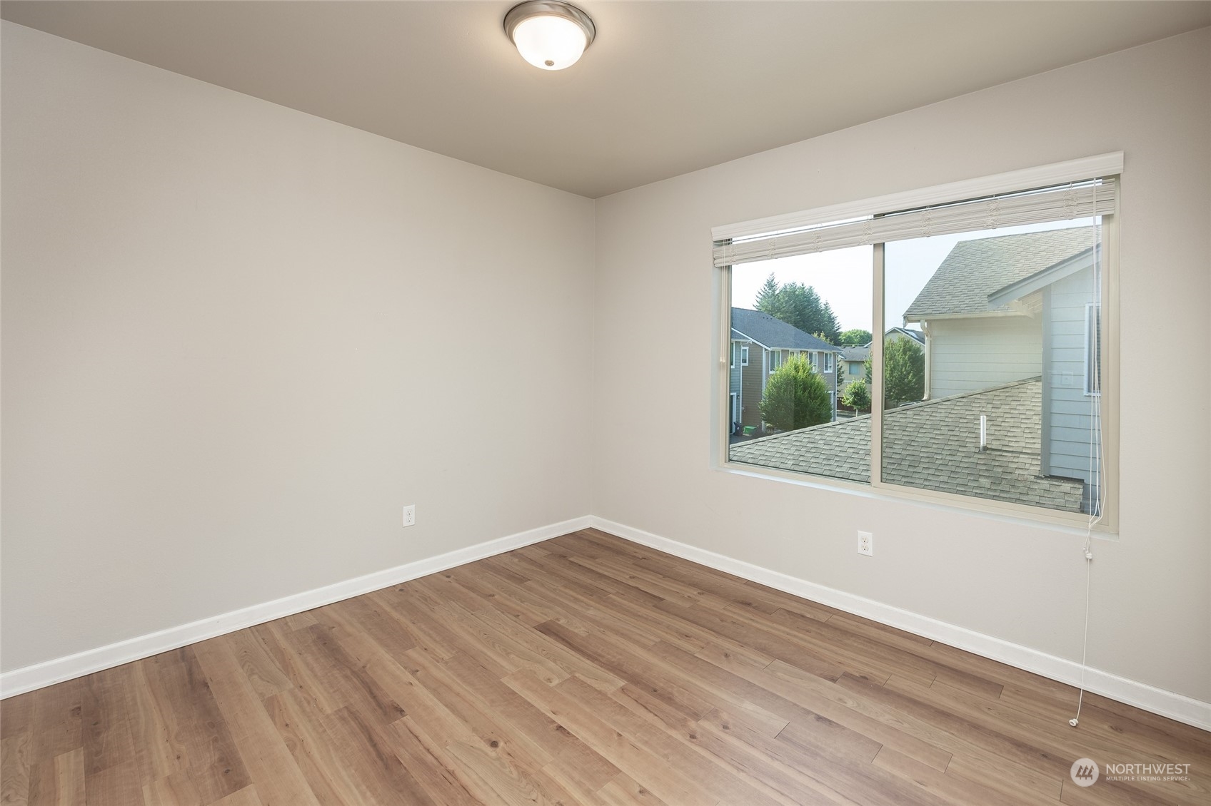 1544 Craig Road Southeast Olympia, WA 98501 - Photo 20 of 31 an empty room with wooden floor and windows