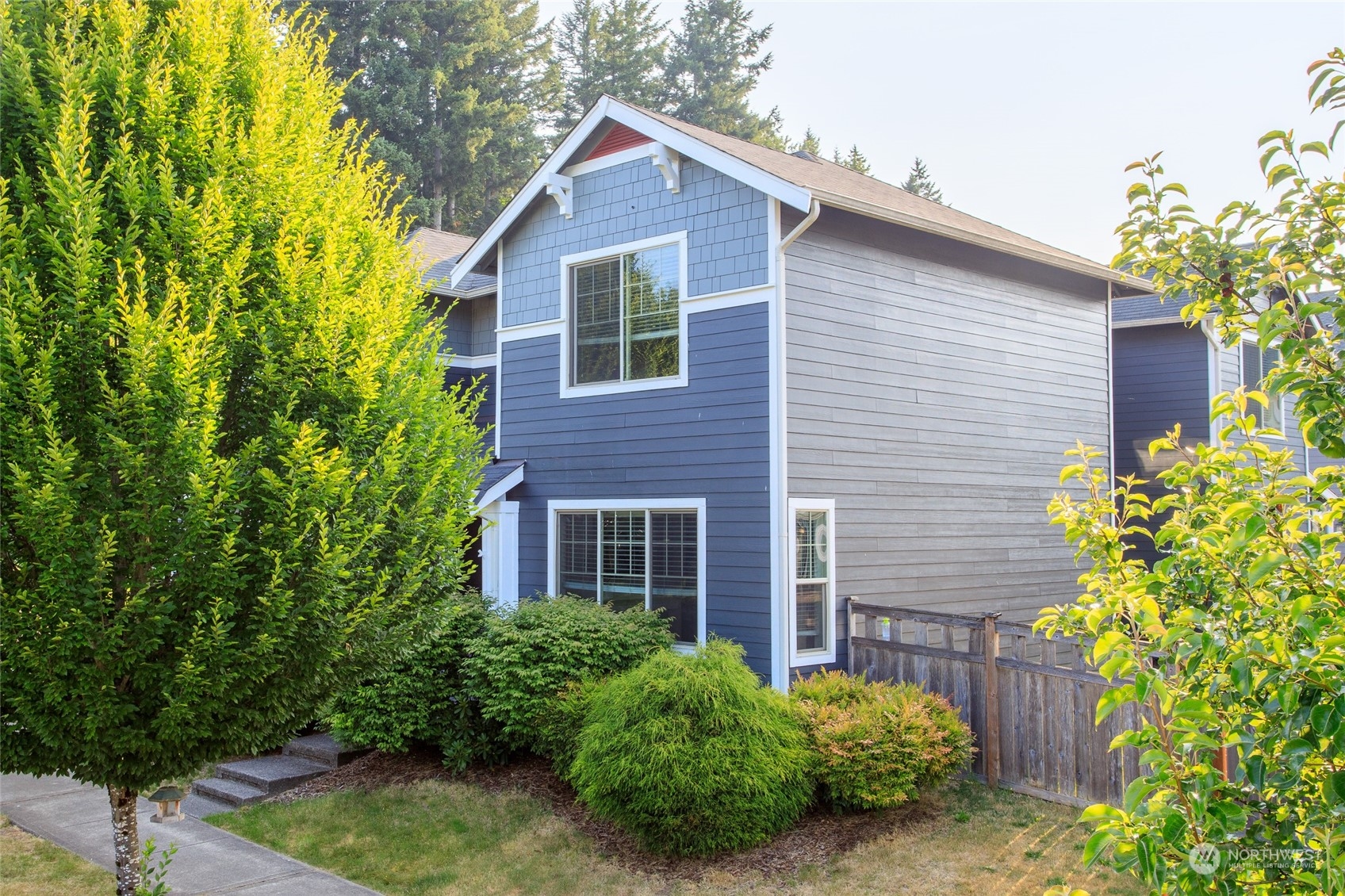 1544 Craig Road Southeast Olympia, WA 98501 - Photo 2 of 31 a view of a house with brick walls plants and large tree