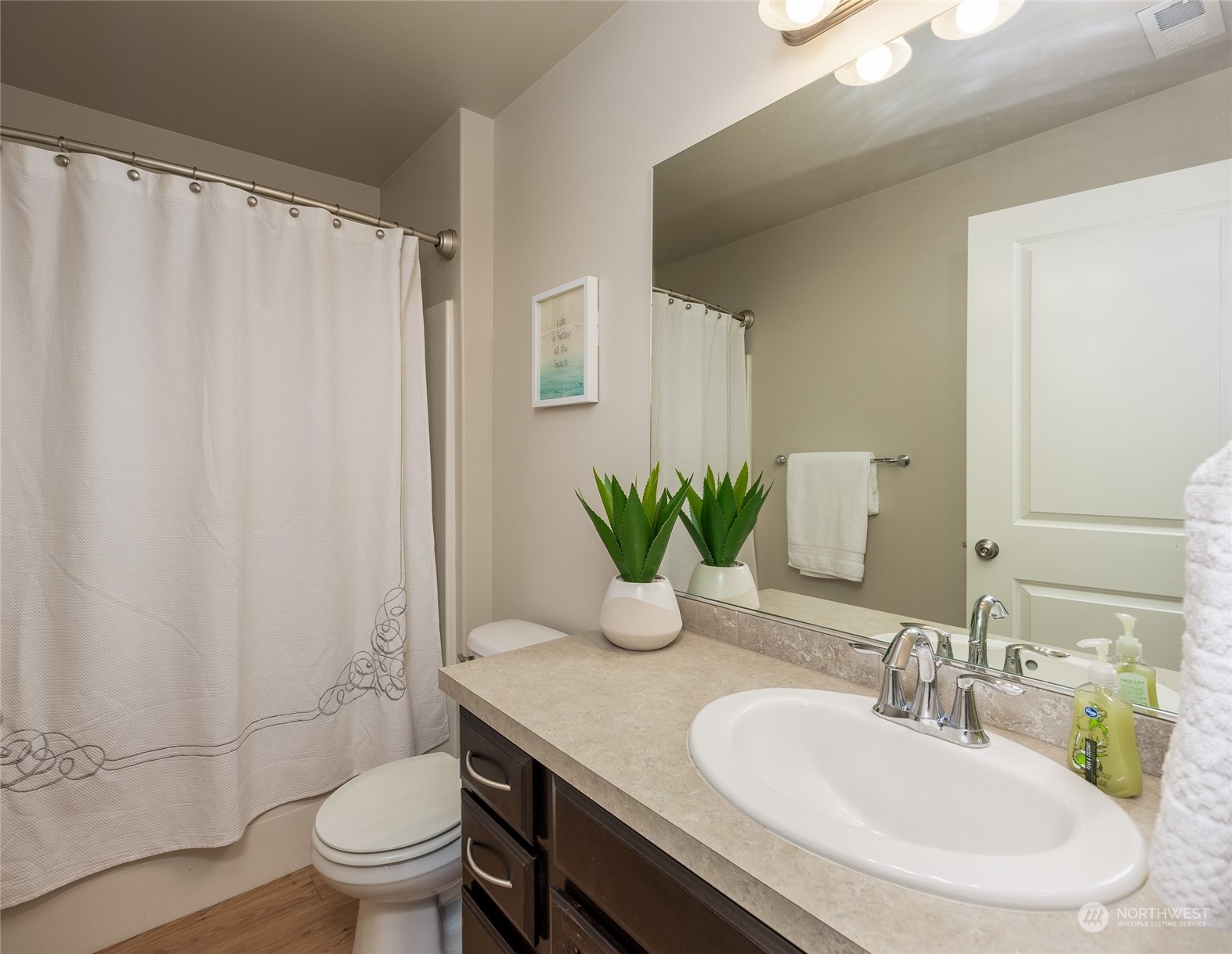 1544 Craig Road Southeast Olympia, WA 98501 - Photo 21 of 31 a bathroom with a granite countertop sink and a mirror