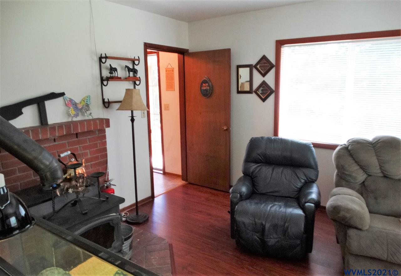 12615 Fishback Road Monmouth, OR 97361 - Photo 3 of 21 a living room with furniture and a flat screen tv