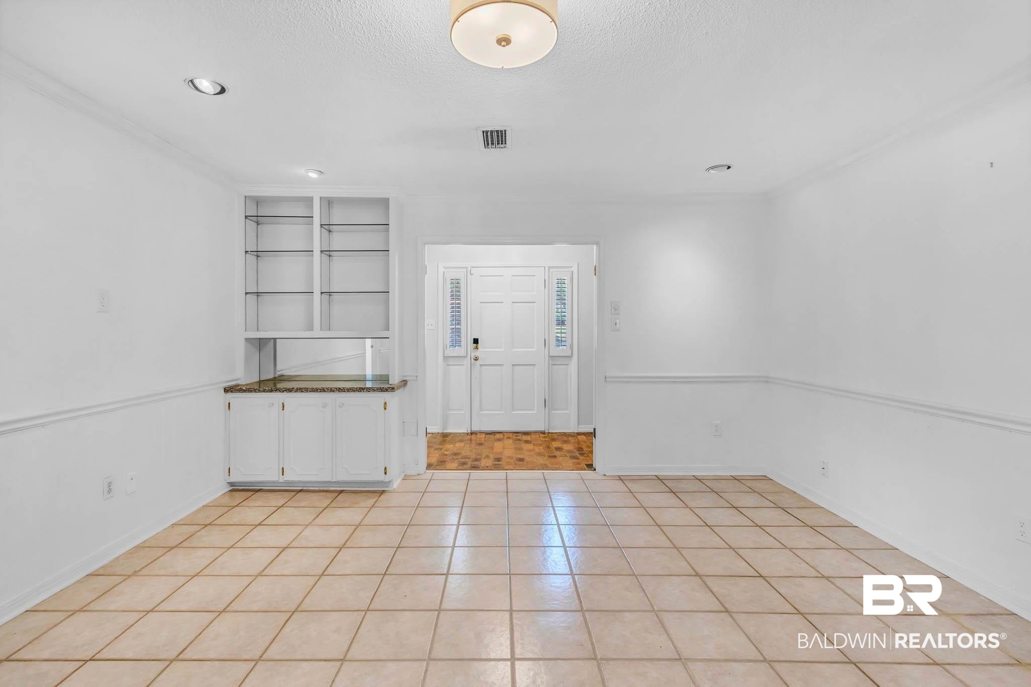 309 West Brandy Run Road Mobile, AL 36608 - Photo 14 of 100 Entryway with light tile patterned flooring, a textured ceiling, and ornamental molding