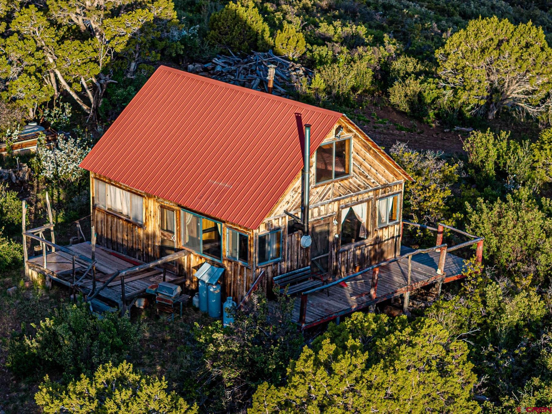 351 Slide Down Road Crawford, CO 81415 - Photo 13 of 34 an outdoor space with lots of trees