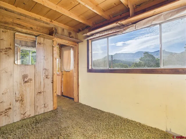 a view of balcony with wooden floor