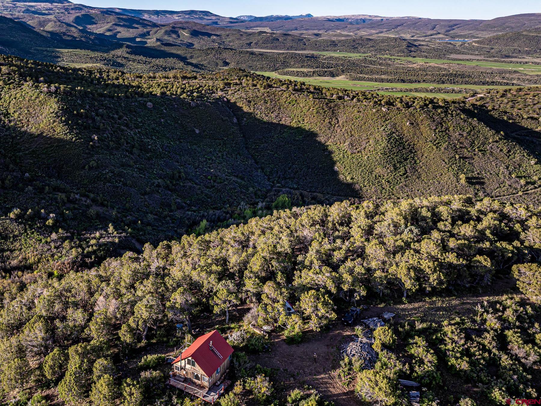 351 Slide Down Road Crawford, CO 81415 - Photo 23 of 34 a view of a city with a mountain