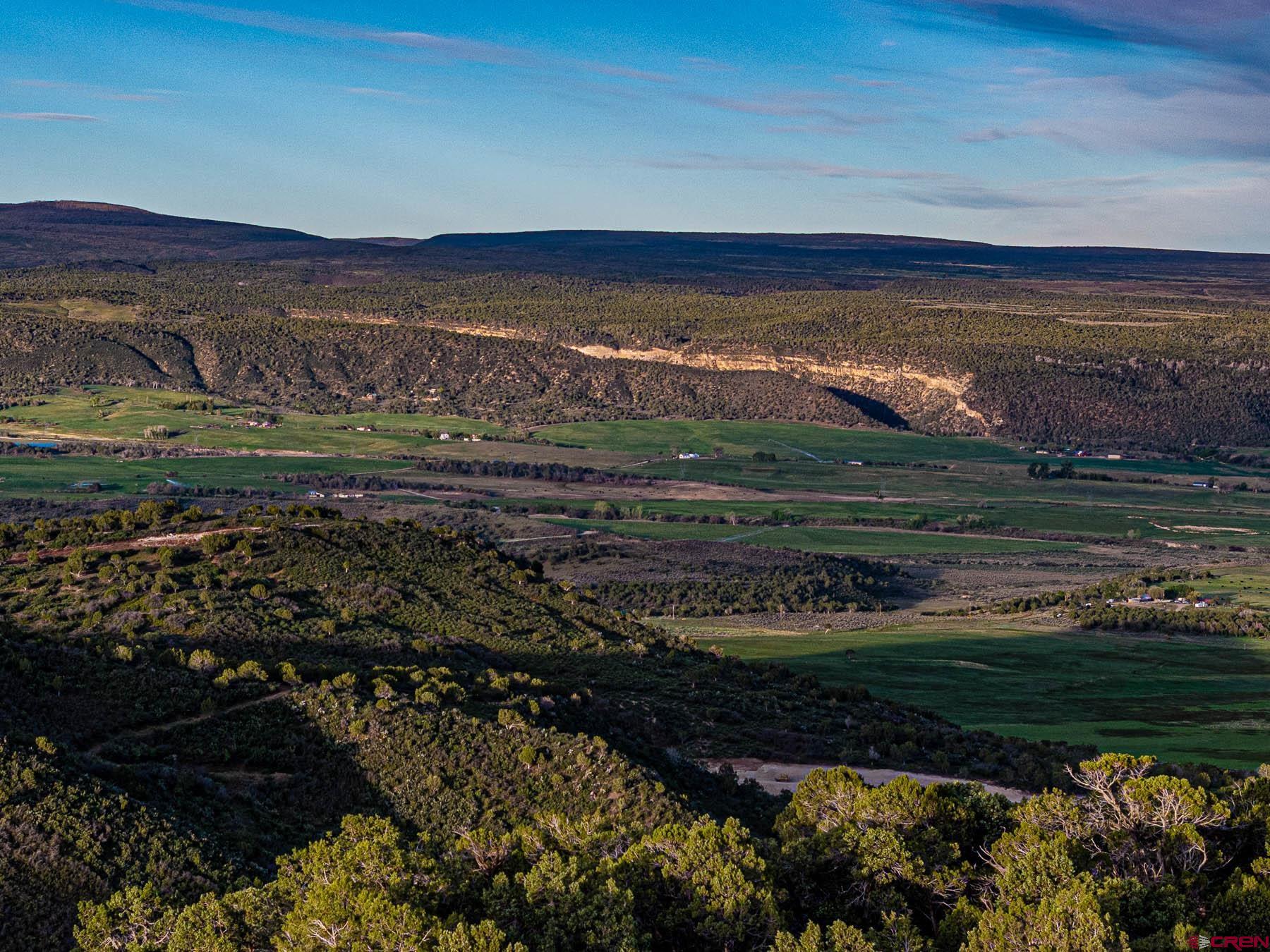 351 Slide Down Road Crawford, CO 81415 - Photo 32 of 34 a view of a lake with a mountain in the background