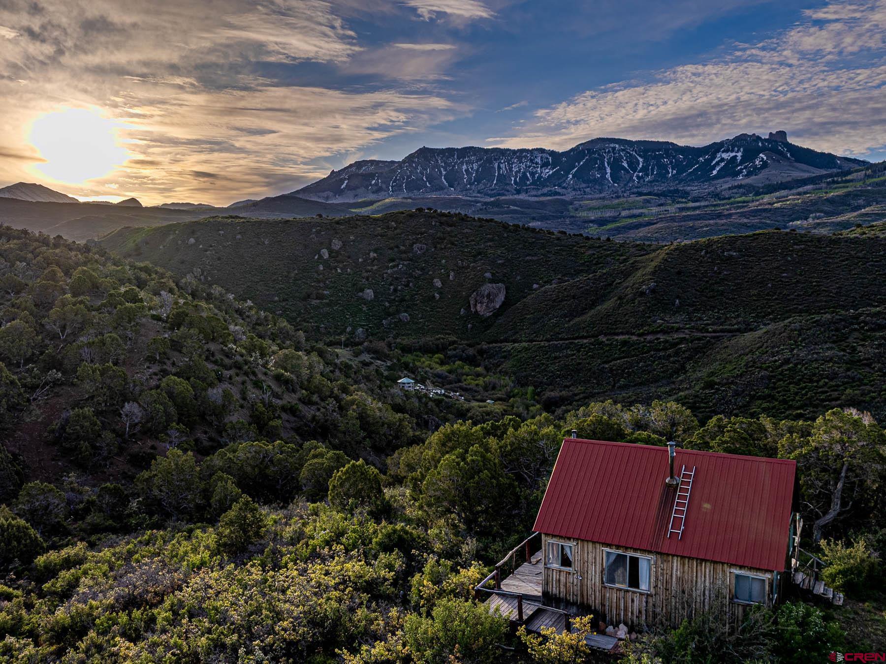351 Slide Down Road Crawford, CO 81415 - Photo 7 of 34 a view of house with yard and outdoor seating