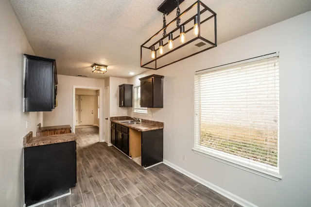 a view of a open kitchen from a windows