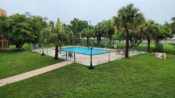 a view of a park with large trees