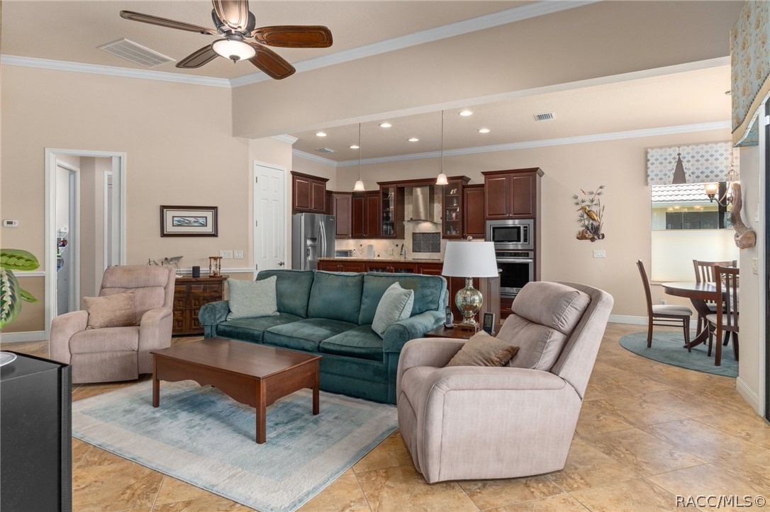 2015 North Rhodes Point Hernando, FL 34442 - Photo 10 of 82 Looking across the Great Room to the Kitchen. The doorway to the left leads to the Guest Bedroom Suite. A glimpse of the Dining area is on the right.