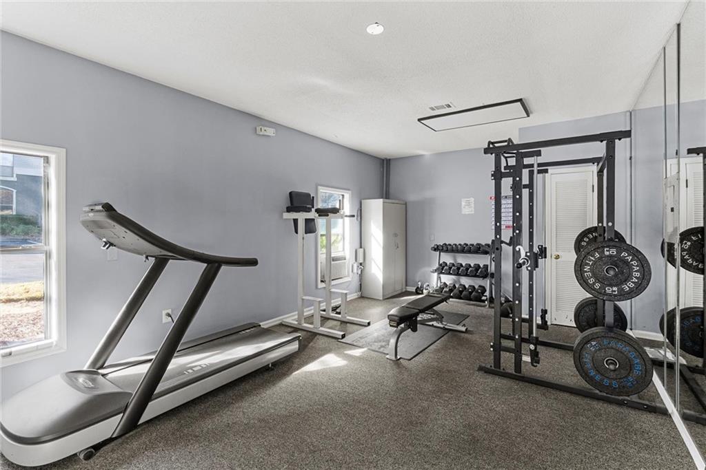 2657 Lenox Road Northeast, Unit L 163 Atlanta, GA 30324 - Photo 24 of 34 a view of a room with gym equipment
