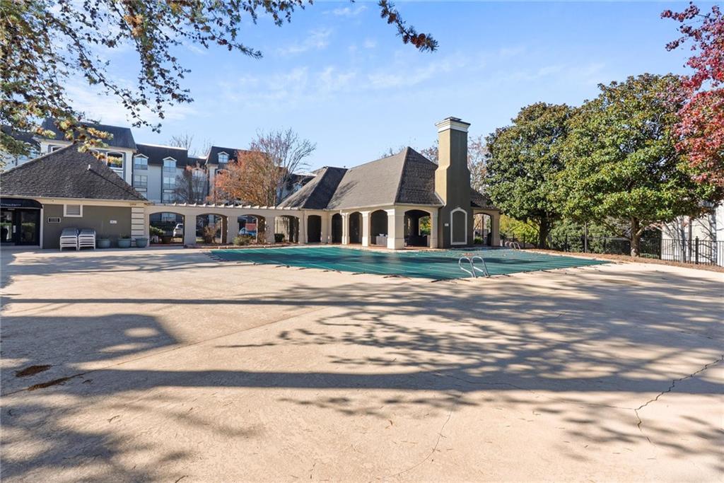 2657 Lenox Road Northeast, Unit L 163 Atlanta, GA 30324 - Photo 26 of 34 a front view of a building with a garden