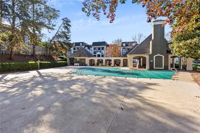 a city street lined with buildings and trees
