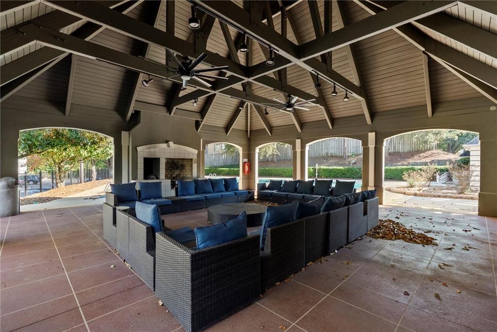 2657 Lenox Road Northeast, Unit L 163 Atlanta, GA 30324 - Photo 28 of 34 a view of a patio with table and chairs a barbeque