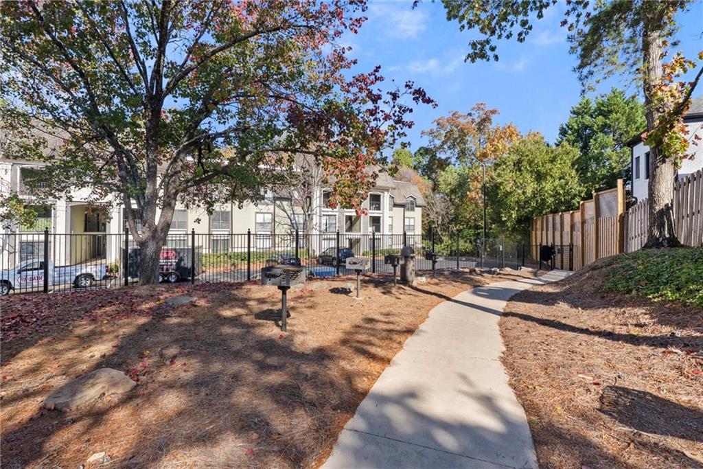 2657 Lenox Road Northeast, Unit L 163 Atlanta, GA 30324 - Photo 30 of 34 a view of a yard with plants and trees