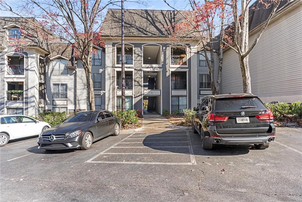 2657 Lenox Road Northeast, Unit L 163 Atlanta, GA 30324 - Photo 32 of 34 a car parked in front of a building