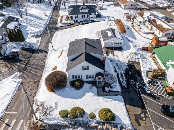 a view of multiple houses with yard