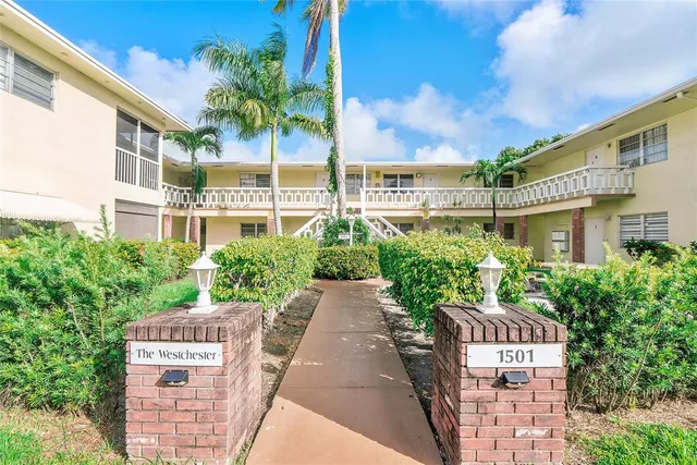 a view of a building with a garden