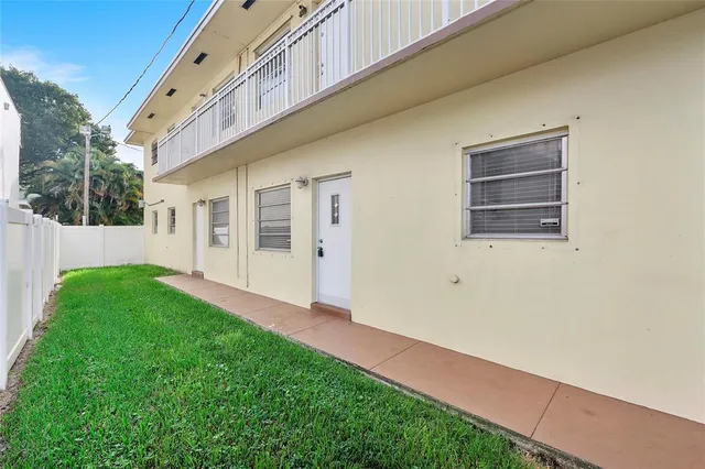 a view of backyard with a garden and plants