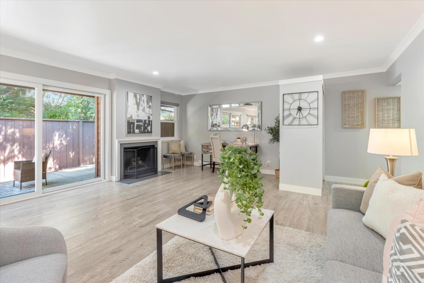 500 West Middlefield Road, Unit 100 Mountain View, CA 94043 - Photo 1 of 47 a living room with furniture and a fireplace
