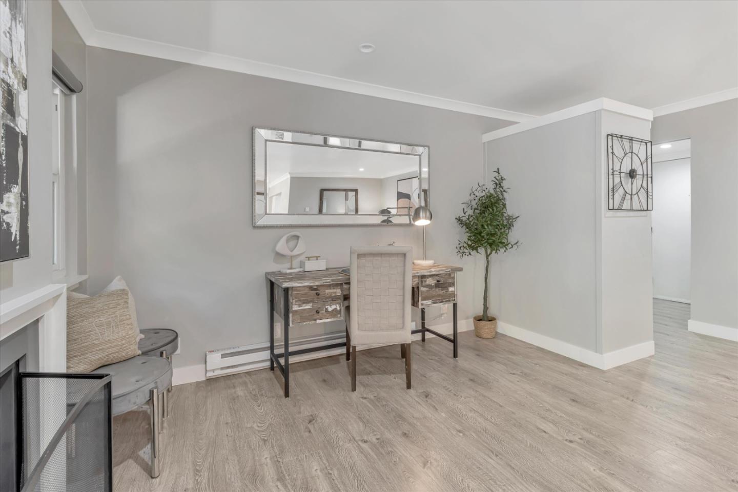 500 West Middlefield Road, Unit 100 Mountain View, CA 94043 - Photo 11 of 47 a living room with furniture and a potted plant