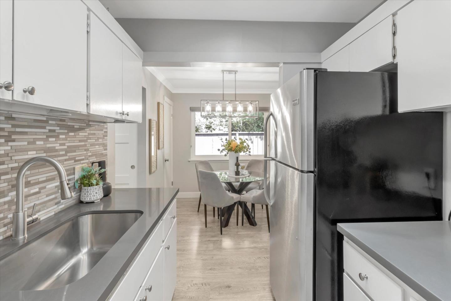 500 West Middlefield Road, Unit 100 Mountain View, CA 94043 - Photo 17 of 47 a kitchen with a refrigerator a sink and a cabinets