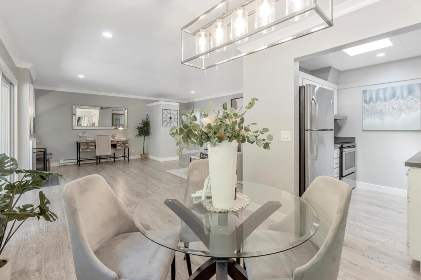 500 West Middlefield Road, Unit 100 Mountain View, CA 94043 - Photo 20 of 47 a dining room with furniture and chandelier